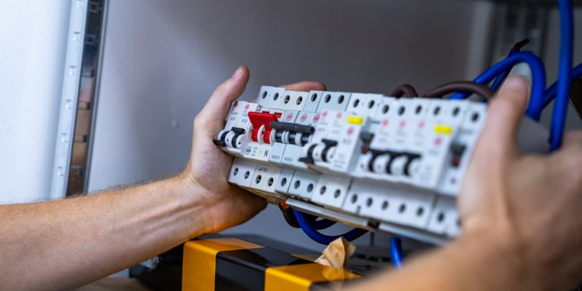 engineer holds a fuse board