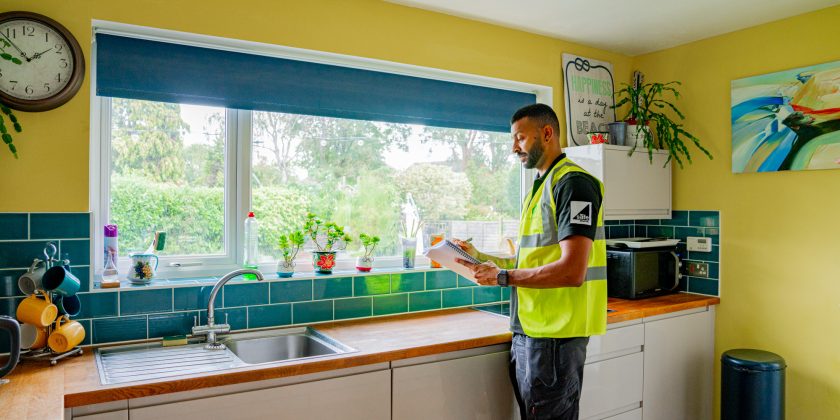 EPC assessor in home carrying out an EPC assessment