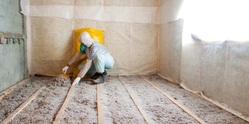 Work composed of cellulose insulation in the floor, floor heating insulation , warm house, eco-friendly insulation, insulation paper, a builder at work